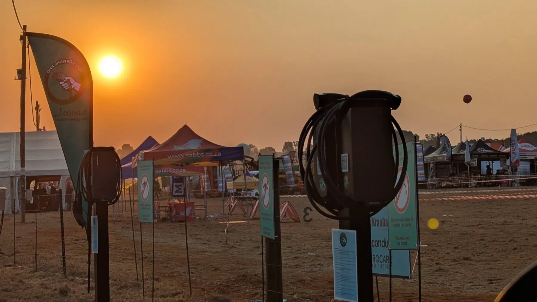 Conduit charge posts and branding at sunset on the KragDag 2026 showgrounds